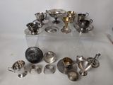 a lot of silver items sitting on a table