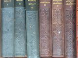 many old books in a box on the shelf