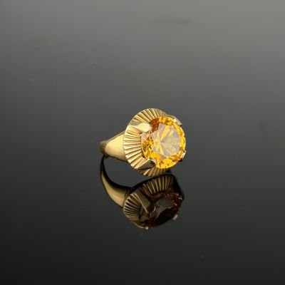 an image of a gold ring with a citrine stone in the center
