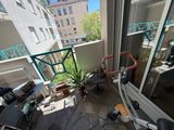 a bicycle that is parked on the balcony of a building