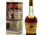 une bouteille de Cusinner Crèmeau à côté d'une boîte