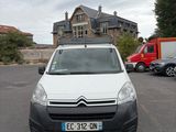 a white van that is parked in a parking lot