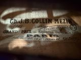 a label on the back of a suitcase that is sitting on the floor