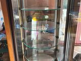 a glass display case with a dog inside of it