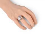 an image of a woman ' s hand with a ring on it ' s finger