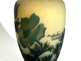 a vase that has a picture of a flower on it
