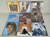 the album covers of various albums are arranged on a table