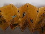 three wooden folding screens with birds and plants painted on them