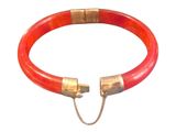 an image of a red bracelet with a gold clasp