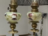 two lamps that are on a table with a lamp shade