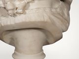 marble bust of a woman with flowers in her hair
