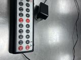 a remote control that is attached to a wall