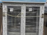 a large window that has been wrapped up on a pallet