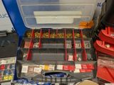 a tool box filled with assorted screws and nuts
