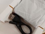 a white box with a pair of scissors inside of it