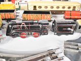 a lot of toy trains that are on a table