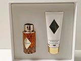 a bottle of perfume and a bottle of lotion in a white box