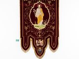 a wall hanging with a picture of an angel on it