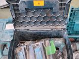 a tool box with tools in it sitting on the floor