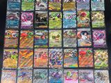 a close up of a bunch of pokemon cards on a table
