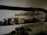 a kitchen with a lot of dishes and dishes on the counter