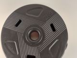 a close up of a metal object on a white surface