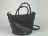 black leather handbag with stars on it on a white background