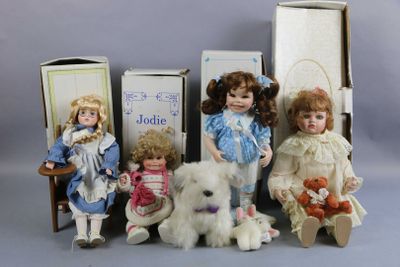 a group of dolls sitting next to each other on a table