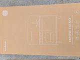 a cardboard box that has a drawing of a cabinet on it
