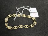 a close up of a bracelet with a tag on it