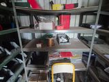 a yellow chair sitting in a room filled with lots of shelves