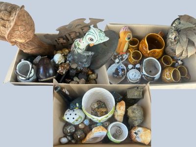 two boxes filled with different types of objects and items