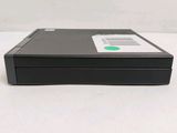 an image of a floppy drive sitting on top of a white table