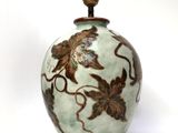 an image of a vase with a lamp on top of it