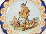 a plate with a picture of a man holding a stick