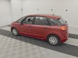 a red car that is parked in a garage
