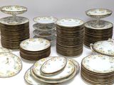 a lot of plates that are sitting on a table