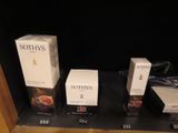 three boxes of sothys sit on a shelf in front of a black background