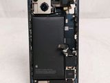 a picture of a cell phone with a broken battery