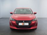 the front view of a red car in a white room