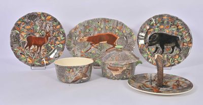 four different plates and cups with animals on them