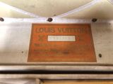 louis vuitton luggage label on a suitcase in a suitcase