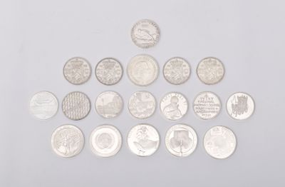 an image of a pile of coins sitting on top of a white surface