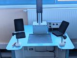 a desk with a laptop and a monitor on it