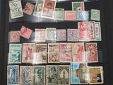 many different types of stamps on a black folder