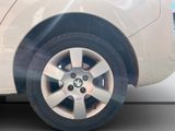 a close up of a tire on a white car
