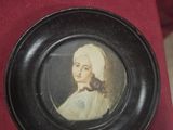 painting of a woman in a white dress with a black frame