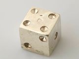an image of a metal dice on a white surface