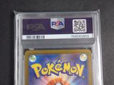 the pokemon card is in a plastic holder on a table