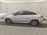 the mercedes gle is parked in the garage of a building